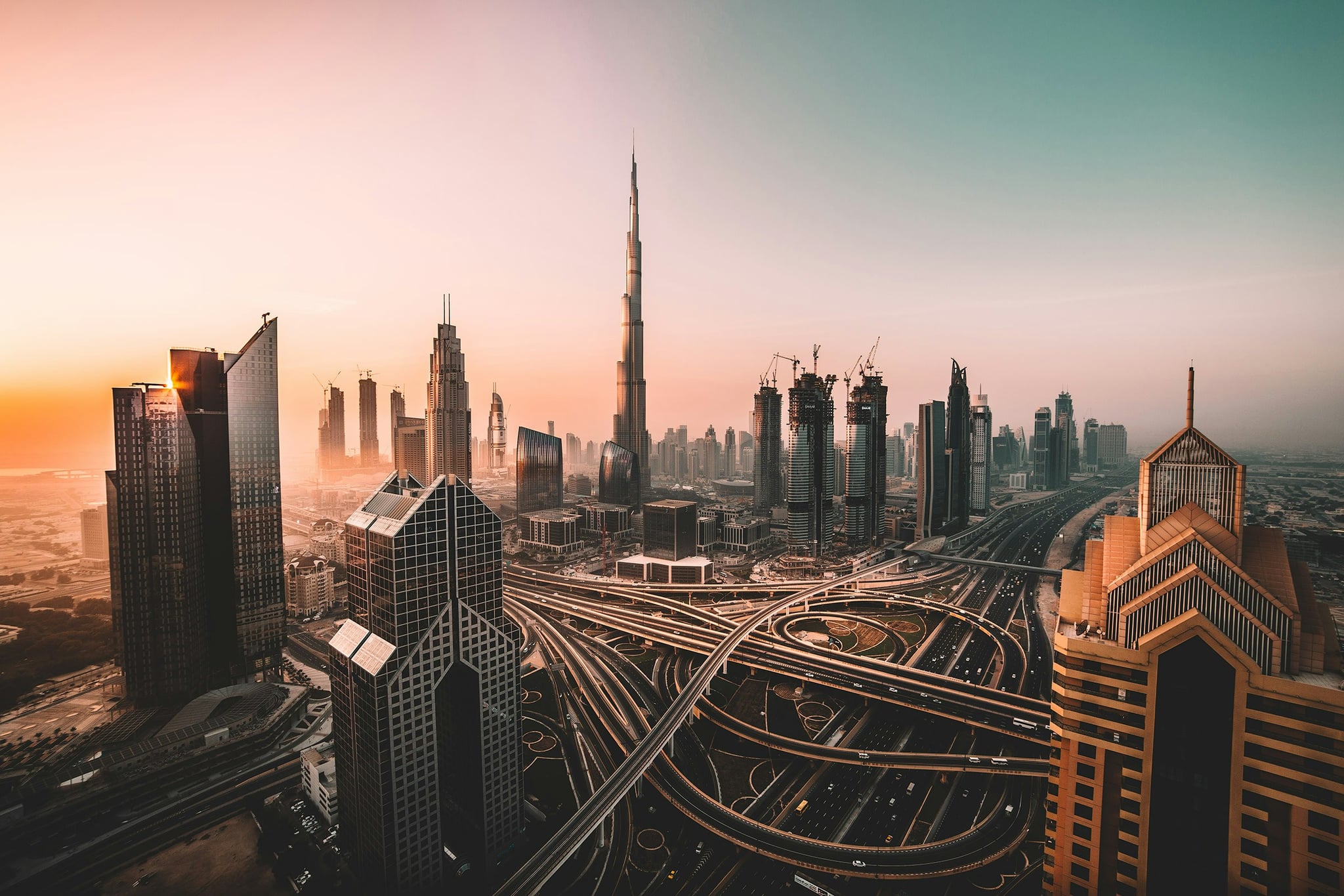 Burj Khalifa and Downtown Dubai skyline at sunrise